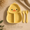 Yellow silicone baby food tray shaped like a duck face, shown with matching yellow fork and spoon on a beige surface with decorative dried flowers and fabric. Text at the bottom reads 'GOKIT SILICONE BABY FOOD TRAY'.