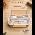 GOKIT stainless steel lunch box with spoon, shown open on a warm beige background with product text, icons, and a small inset detail of the spoon.